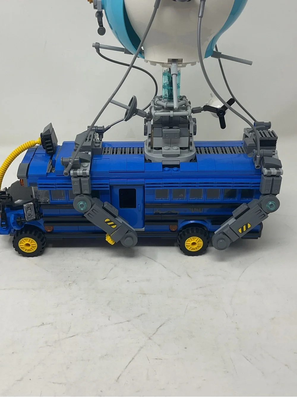 LEGO Blue and White Fortnite Battle Bus with Yellow Accents